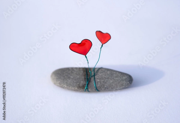 Obraz Wire-Wrapped Stone with Red Hearts from resin. Handmade Valentine’s Ornament on Natural Stone