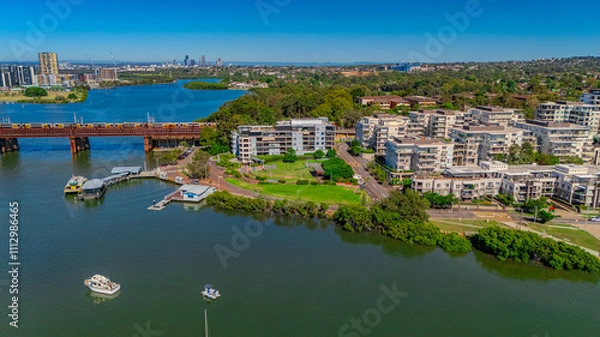 Fototapeta Panorama Aerial view above Rhodes with views to Meadowbank and Olympic park and Wentworth Point and Concord West with Parramatta River in Sydney NSW Australia