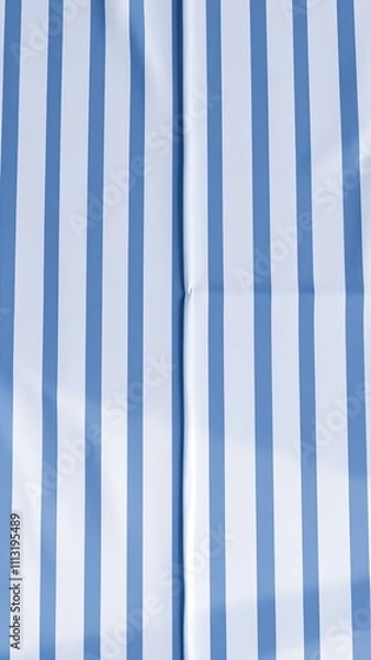 Fototapeta Picnic table cloth with white and blue striped pattern, casual picnic, summer picnic, blanket for picnic, garden party