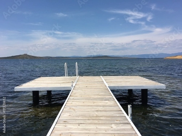 Fototapeta view from the pier on the sea at loneliness beach on cunda island balikesir turkey