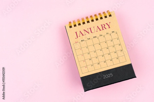 Fototapeta January 2025 desk calendar on pink color background, Position with copy space.