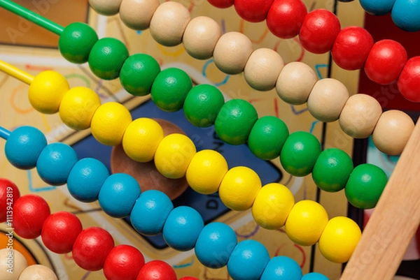 Fototapeta Colorful wooden abacus beads close-up.  Learning, education, and counting concept.