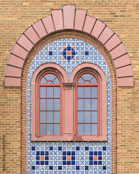 Obraz Two decorative windows surrounded by mosaic tiles under arch
