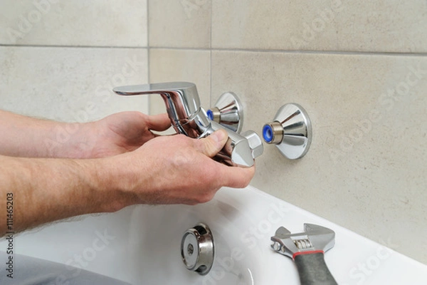 Obraz Installing bath faucet.