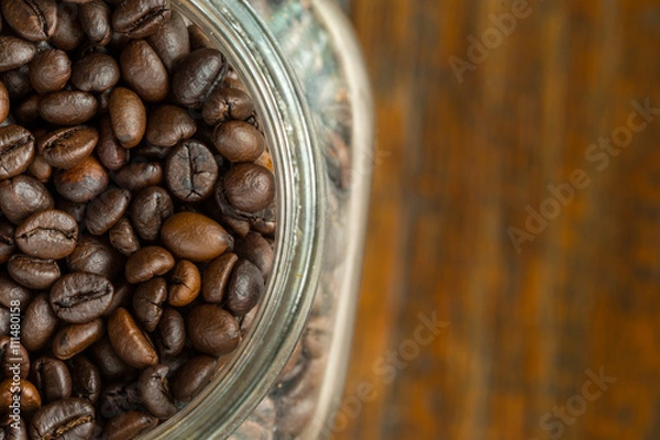 Obraz Coffee beans on wood background