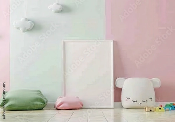 Fototapeta Blank Frame Mockup in a Pastel Pink and Green Nursery with Pillows. Toys. and Cloud Decorations