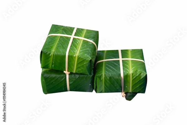 Obraz Vietnamese Chung Cake isolated on white background (Banh Chung, a traditional Vietnamese New Year's dish)