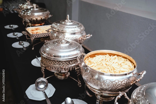 Obraz a buffet table with silver plates with food