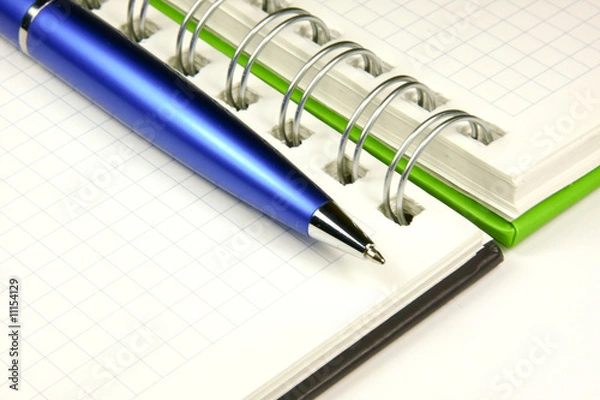 Obraz Notebook and a pen closeup