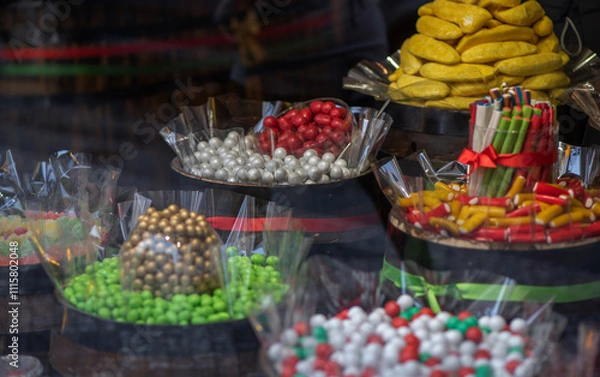 Fototapeta Various choices candy on display shelf in sweet-shop.