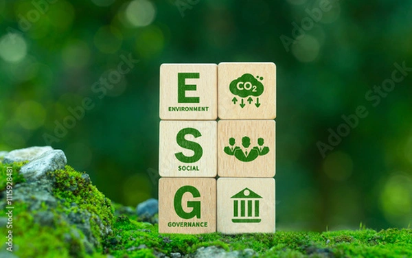 Fototapeta Green ESG icon on wooden block. Environment, social and governance concept. Net zero greenhouse gas emissions for a sustainable global environment. On a green forest background.