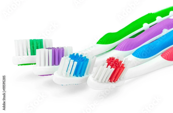 Obraz Четыре зубные щетки крупным планом на изолированном белом фоне