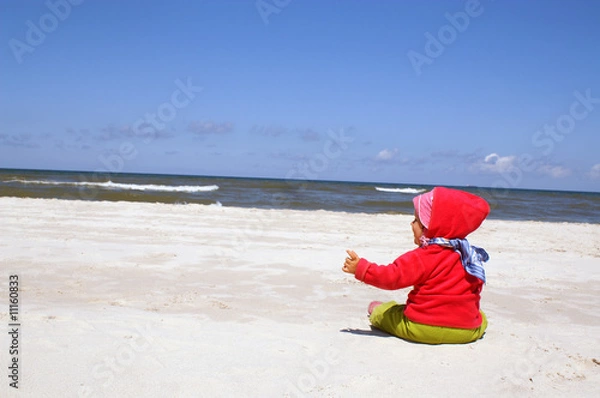 Obraz Girl sits on beach
