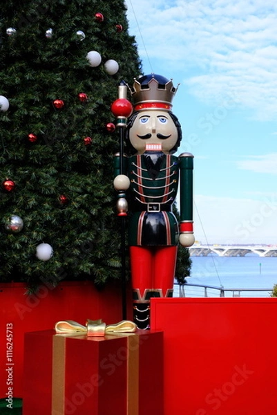 Obraz Large nutcracker and Christmas tree display