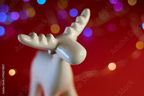 Obraz A Beautiful White Moose Figurine Set Against a Bright and Colorful Bokeh Background