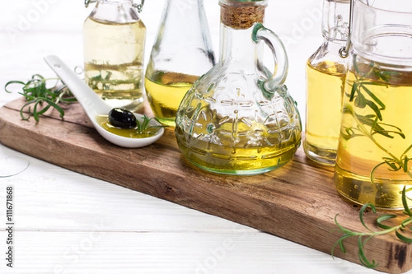 Obraz Oils on vintage wooden background . healthy food