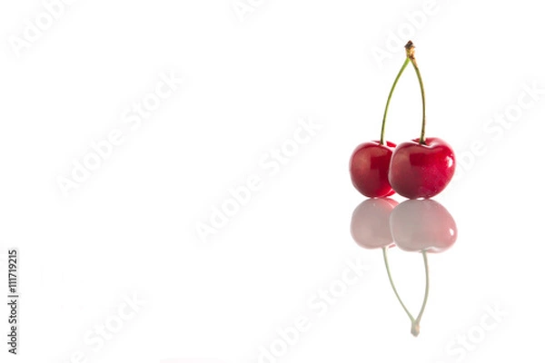 Fototapeta Two cherries on a white background