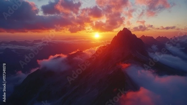 Obraz Breathtaking Aerial View of Majestic Mountain Landscape at Sunset with Vibrant Colors and Dramatic Clouds Underneath a Clear Sky