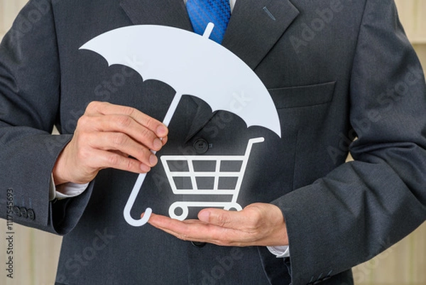 Fototapeta "Consumer protection law and business transactions." The businessman holding an umbrella over a shopping cart signifies financial protection, insurance for purchases, and trust in trade practices.
