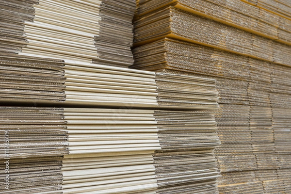Fototapeta stack of corrugated cardboard boxes. egde view of flattened boxe