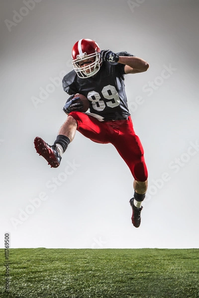 Fototapeta The american football player in action