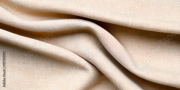 Fototapeta A close-up view of soft, beige fabric, showcasing its gentle drapes and texture, ideal for fashion and interior design applications.