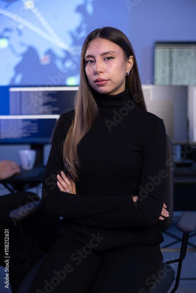 Fototapeta Portrait of a confident female Cybersecurity Analyst or Manager in large Cyber Security Operations Center SOC handling Threats