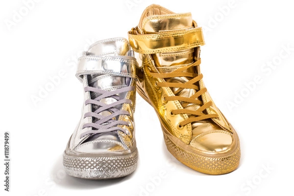 Fototapeta Pair of different sneakers isolated