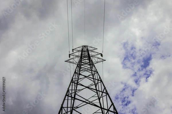 Fototapeta Pylon and transmission power line in cloudy day