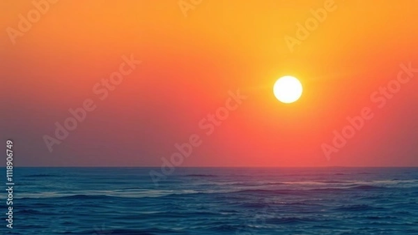 Fototapeta Gradual transition from dark blue to soft pink as the sun rises above the horizon casting a warm glow on the ocean's surface, peaceful, nature