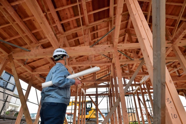 Fototapeta 住宅建築工事を点検する設計エンジニア