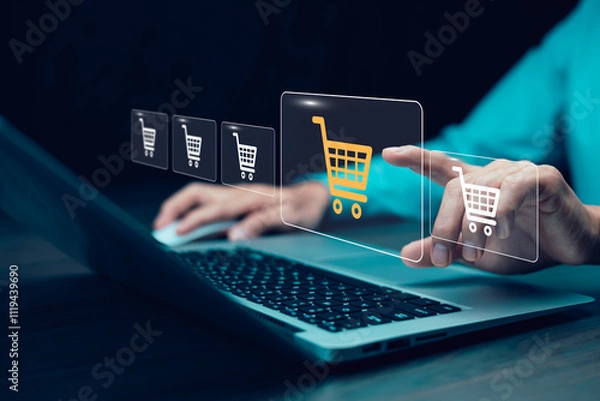 Fototapeta Businessman hold smartphone with online shopping concept, marketplace website with virtual interface of online Shopping cart part of the network, Online shopping business with selecting shopping cart.