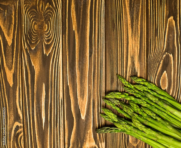 Obraz Green asparagus. Fresh asparagus on aphids. View of the beast. Free space for your text.
