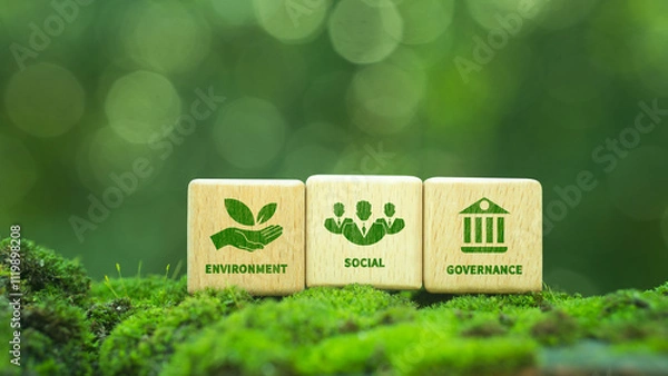 Fototapeta Green ESG icon on wooden block. Environment, social and governance concept. Net zero greenhouse gas emissions for a sustainable global environment. On a green forest background.