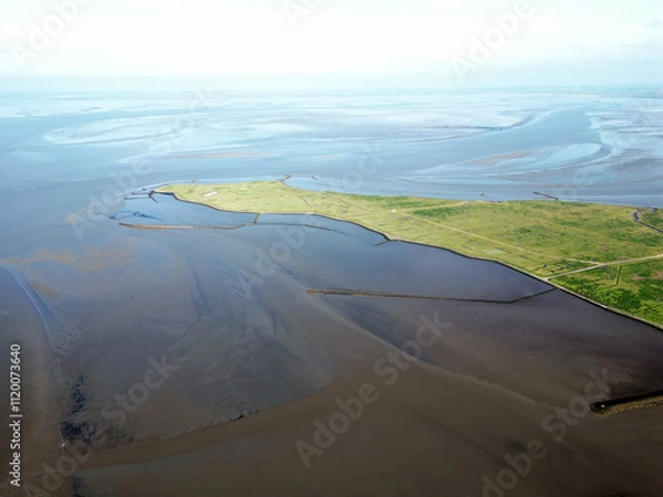 Fototapeta Aerial view of the tidal mudflats and channels of the Eemsdelta and Dollard, Groningen, The Netherlands