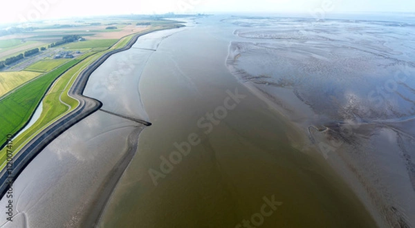 Fototapeta Aerial view of the tidal mudflats and channels of the Eemsdelta and Dollard, Groningen, The Netherlands