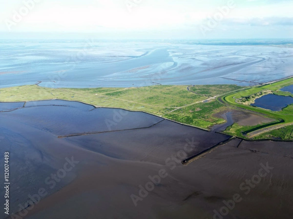 Fototapeta Aerial view of the tidal mudflats and channels of the Eemsdelta and Dollard, Groningen, The Netherlands