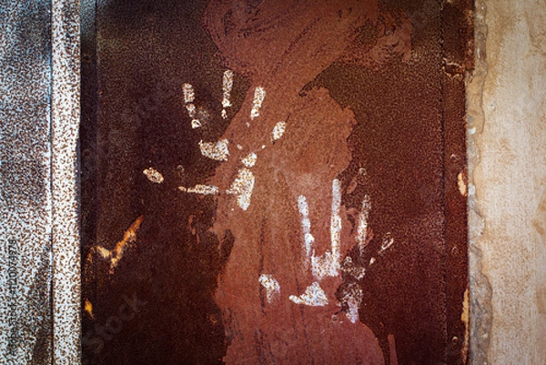 Fototapeta abstract photograph , a human palm print on an old surface