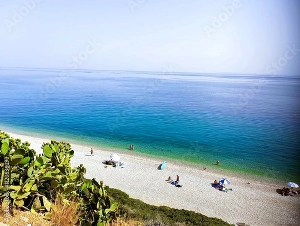 Fototapeta Kakia skala pebble beach. Calm crystal clear waters. A hidden gem near Athens.
