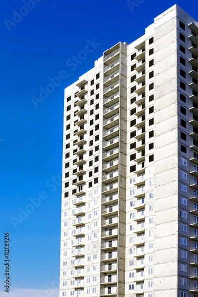 Fototapeta High-rise residential building under construction.
