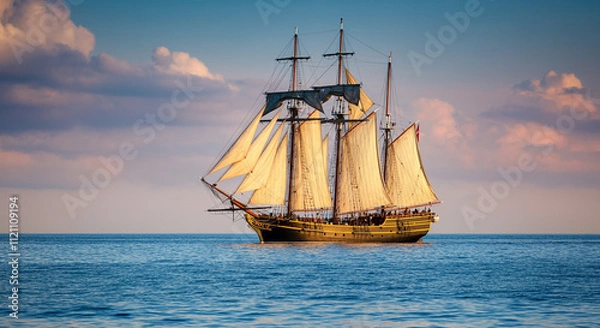Fototapeta Vintage sailing ship cruising on the ocean at sunset