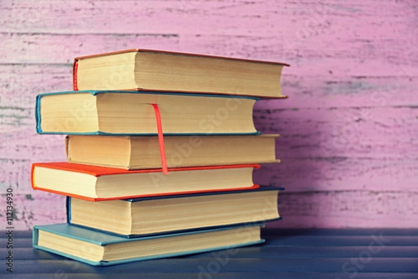 Fototapeta Pile of books on wooden background