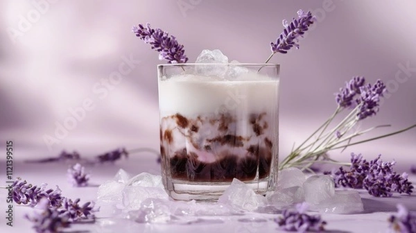 Obraz A refreshing lavender drink served in a glass, adorned with ice and sprigs of lavender, set against a soft purple background.