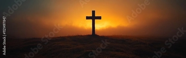 Fototapeta Silhouette of a Christian Cross Against a Dramatic Glowing Sky