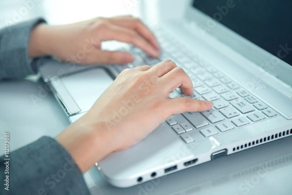 Fototapeta business woman hand typing on laptop keyboard