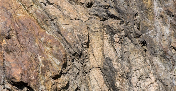 Obraz Stone background, rock wall backdrop with rough texture. Abstract, grungy and textured surface of stone material. Nature detail of rocks.