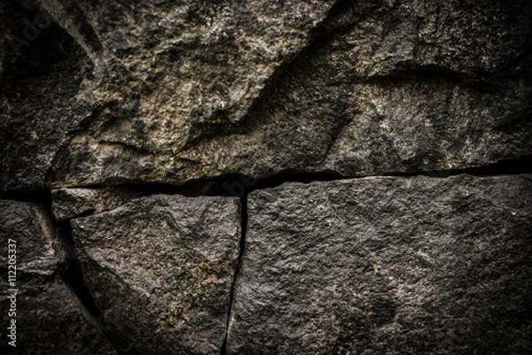 Fototapeta Stone background, rock wall backdrop with rough texture. Abstract, grungy and textured surface of stone material. Nature detail of rocks.