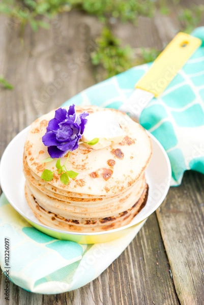 Obraz Pancakes with a butter slice
