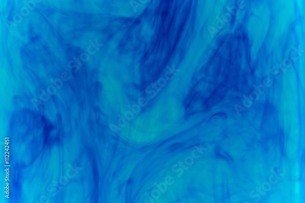 Obraz Abstract pattern falling into the water drop of blue ink - cyan ink dissolved in water
