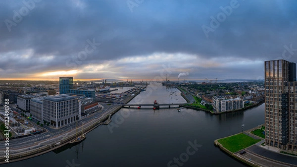Obraz The image showcases a bustling waterfront scene at Dublin Port, featuring a modern bridge spanning across the harbour in Dublin Ireland